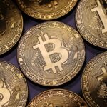gold 'coins' with Bitcoin logo; visual representation of the digital Cryptocurrency, Bitcoin