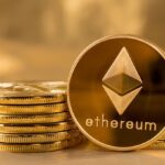 Picture of ethereum coins staked together with one coin stood next to them